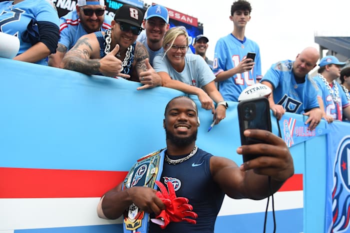 Tennessee Titans linebacker Azeez Al-Shaair (2) takes a selfie with fans before the game against the Atlanta Falcons at Nissan Stadium. Mandatory Credit: Christopher Hanewinckel-USA TODAY Sports